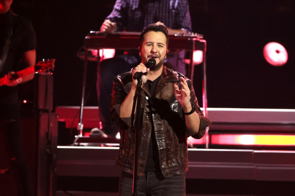 Luke Bryan singing into a microphone